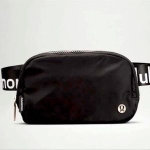 LOGO EVERYWHERE BELT BAG Black with White Lululemon Letters on Strap Extended